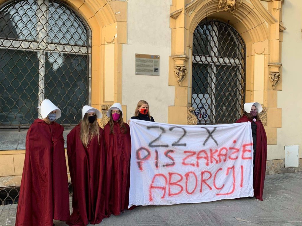 Protesters dress as handmaids from The Handmaid's Tale